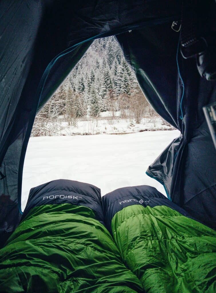 Sleeping bags inside a tent on a winter camping