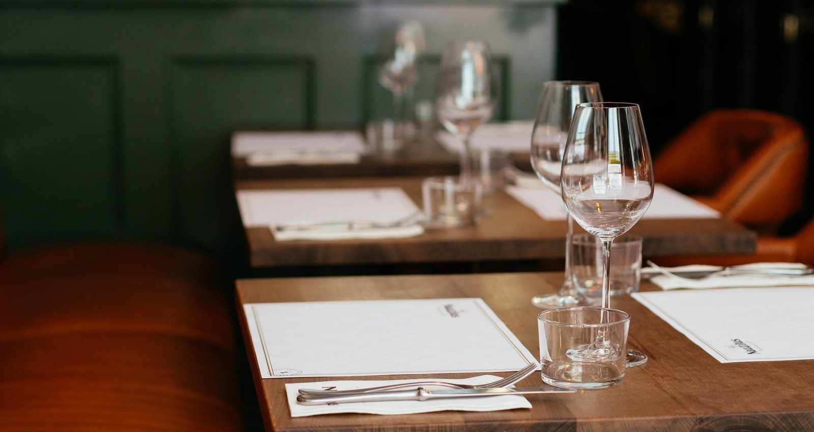 Clear Long-stemmed Wine Glass on Brown Table