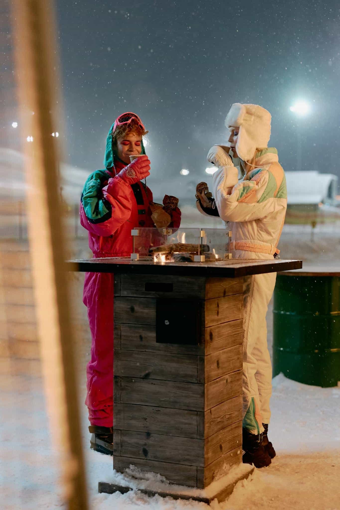 Women in Ski Suit Drinking Coffee