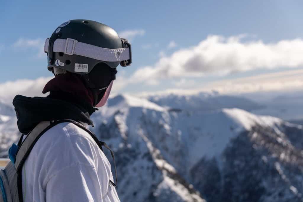 Skier wearing a ski helmet watching the Andes mountains